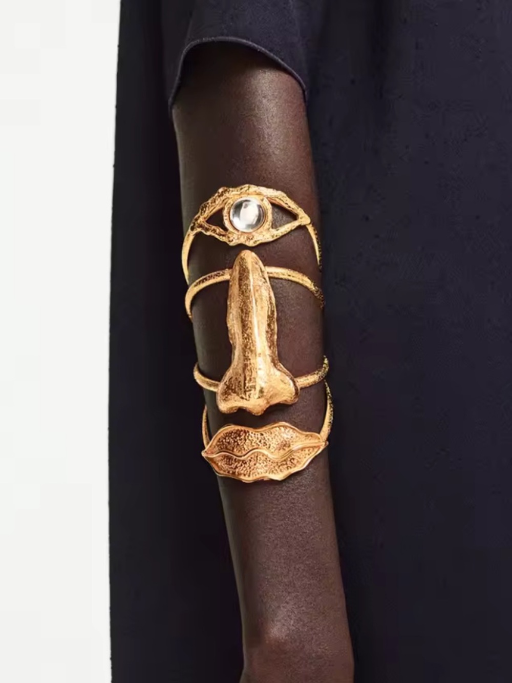 Golden Surrealist Face Cuff Bracelet